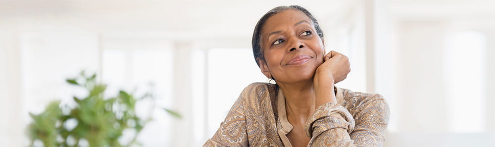 An older woman looking up, smiling