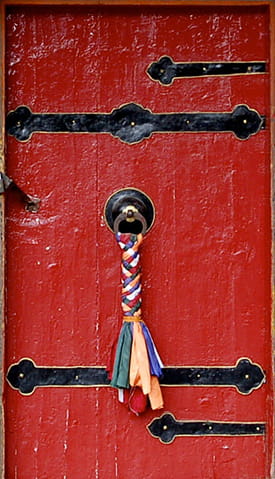 Red door with tassel